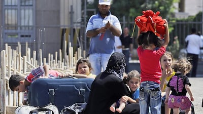 Syrian refugees arriving in Turkey, which will receive more funding from the EU to look after the people it shelters. AP