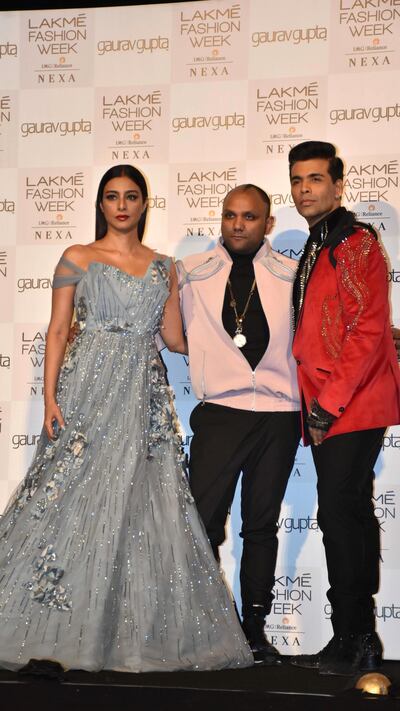 Designer Gaurav Gupta, centre, with Tabu and Karan Johar at Lakme Fashion Week