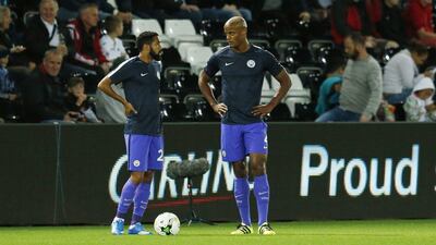 Manchester City’s Vincent Kompany and Gael Clichy warm up before the match. Andrew Boyers / Action Images / Reuters