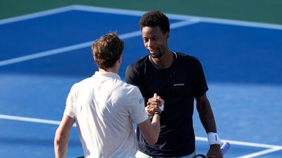 Ugo Humbert of France, left, is congratulated by countryman Gael Monfils after his 4-6, 6-3, 6-3 victory. AP
