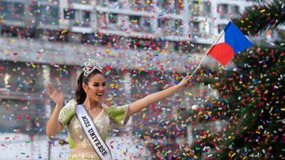 Miss Universe 2018 Catriona Gray of the Philippines waves to fans during a parade held in her honour in Manila. AFP