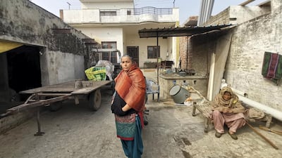 Sukhvir Kaur and her mother-in-law outside the family home in Rauni village in Punjab.