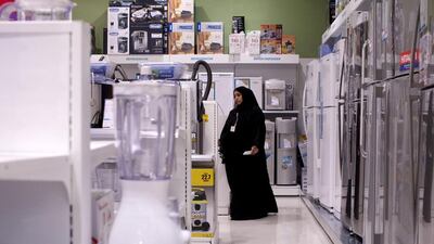 Emirati employees at the Sharaf DG electronics store in the Century Mall in Fujairah on February 6, 2013. Christopher Pike / The National