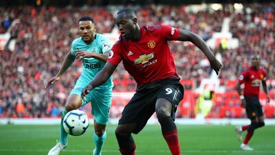 Romelu Lukaku of Manchester United is challenged by Jamaal Lascelles of Newcastle United. Getty Images