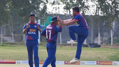 Nepal celebrate a wicket against UAE.