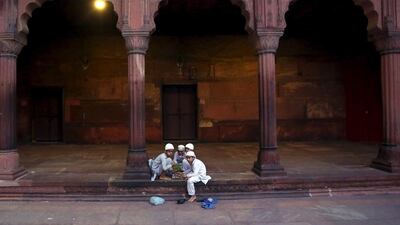 Muslim children eat their iftar (breaking of fast) meal during the holy month of Ramadan at the Jama Masjid (Grand Mosque) in the old quarters of Delhi, India, on June 20, 2015. Anindito Mukherjee / Reuters