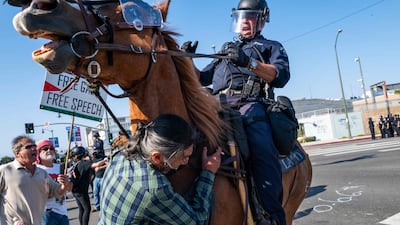 The National Guard, police and protesters clash following two days of protests after a series of immigration raids. AFP
