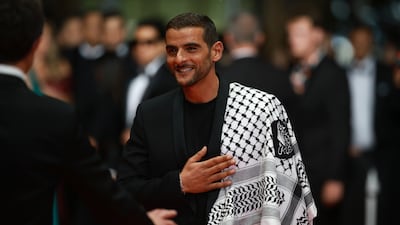 French rapper Sofiane Zermani wears a Palestinian keffiyeh during the Cannes Film Festival. EPA