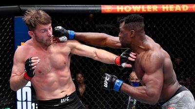 Francis Ngannou punches Stipe Miocic in their UFC heavyweight championship fight. Jeff Bottari / USA TODAY Sports / Reuters