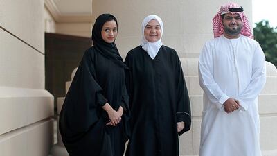 Ibrahim bin Madhi, 25, right, a mechanical engineer student and Radhya Mohamed, 22, left, a finance student, with Rima Shaban, the manager of the Innovation and Entrepreneurship Center at Abu Dhabi University. Christopher Pike / The National