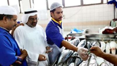 Fish are snapped up at the market in Abu Dhabi yesterday even though prices have doubled over the past two months.