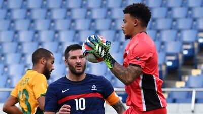 South Africa's goalkeeper Ronwen Williams collects the ball ahead of France's forward Andre-Pierre Gignac.
