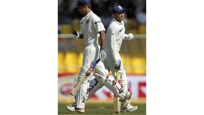 India’s Virender Sehwag, right, and Rahul Dravid run between wickets in the first Test against New Zealand in Ahmedabad.