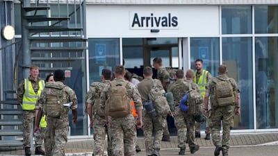 Soldiers from a UK evacuation flight land in Brize Norton, Oxfordshire, on Sunday. AFP