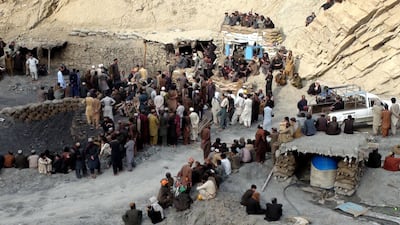 Pakistani miners gather outside the collapsed mine in Marwaarh area, 45 kilometres east of Quetta, the capital of oil and gas-rich Balochistan province on May 5, 2018. AFP