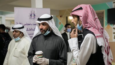 Former Speaker of the Parliament Marzouk Al-Ghanim stands at a polling station during parliamentary elections in Kuwait City. Reuters