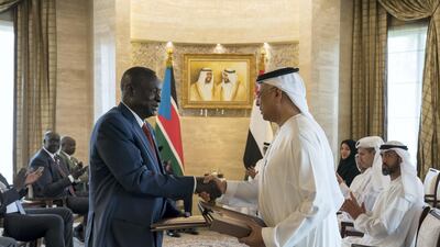 Obaid Humaid Al Tayer, UAE Minister of State for Financial Affairs (R), exchanges an MOU with a South Sudanese counterpart during an MOU signing ceremony at Al Shati Palace. Mohamed Al Hammadi / Ministry of Presidential Affairs
