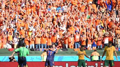 Robin van Persie congratulates Memphis Depay after his winning goal in the Netherlands' 3-2 victory over Australia on Wednesday at the 2014 World Cup. William West / AFP / June 18, 2014