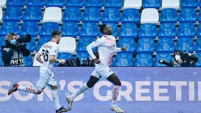 AC Milan's Portuguese forward Rafael Leao celebrates after opening the scoring. AFP