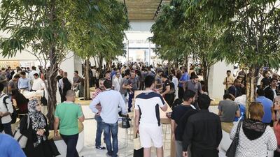 Apple fans pack the store after its opens. Sarah Dea / The National
