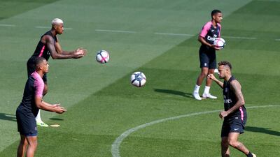 Mbappe and Neymar play the ball during a training session. AP Photo
