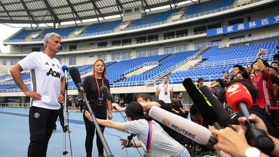 Manchester United manager Jose Mourinho (L) talks to journalists following his team’s training session at the Olympic Sports Center in Beijing, China, 24 July 2016. How Hwee Young / EPA
