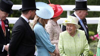Queen Elizabeth II , Autumn Phillips, centre, and Peter Phillips at Ascot Racecourse. Jonathan Brady / PA Wire