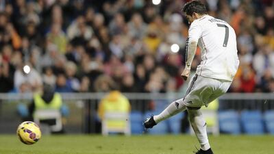 Real Madrid’s Cristiano Ronaldo kicks a penalty and scores a goal during Madrid's victory in La Liga on Saturday. Daniel Ochoa de Olza / AP