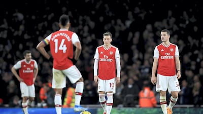 Ozil of Arsenal and Granit Xhaka after Neal Maupay scored for Brighton at the Emirates Stadium. Getty