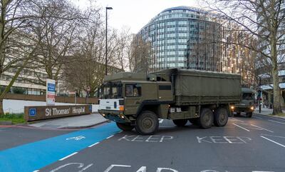 Soldiers from Royal Logistics Corps delivering facemasks to St Thomas' Hospital in London. AP