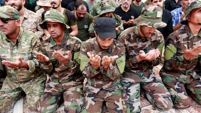 Members of the Hashed Al Shaabi, also known as the Popular Mobilisation Forces (MPF), mourn a fighter, who was killed by an unmanned aircraft close to the Syrian border in Anbar, during his funeral in Najaf, Iraq August 26, 2019. Reuters