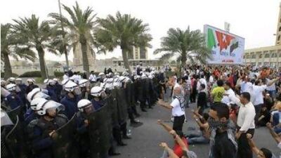 Protesters block a main thoroughfare leading to the Bahrain Financial Harbour, a key business district.