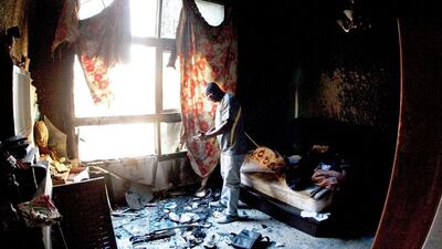 Standing in what was his bedroom Dove Ifeanyi estimates he lost 200,000 AED in cash and belongings when a fire gutted several apartment last week in the Al Baker Apartments in Sharjah City, Sharjah. Jeff Topping / The National