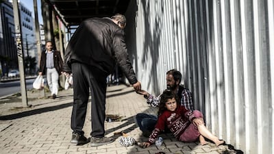 Syrian refugees in Istanbul. Human rights campaigners and the European Union are likely to welcome Ankara's move to grant work permits to refugees, most of whom are working illegally and for minimal wages. Bulent Kilic/AFP