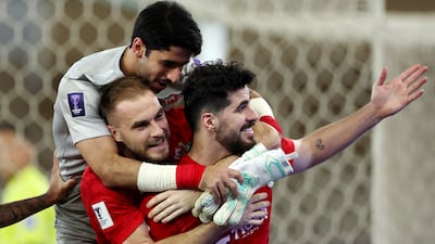 Saeid Ezatolahi celebrates scoring Shabab Al Ahli's second goal with teammates. Getty Images