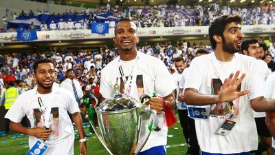 Al Nasr’s Esam Dhahi celebrates with the trophy after winning the UAE President’s Cup against Al Ahli on June 3, 2015 at Sheik Hazza bin Zayed Stadium in Al Ain. AFP PHOTO / STR