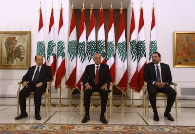 Lebanese President Michel Aoun, left, and Parliament speaker Nabih Berri, centre, with then prime minister Saad Hariri at the presidential palace in November 2017. AFP Photo