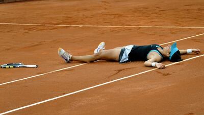 French tennis player Caroline Garcia celebrates after beating Serbia’s player Jelena Jankovic in the final match of the WTA Bogota Open, in Bogota, on April 13, 2014. AFP PHOTO / Guillermo LEGARIA