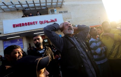A Palestinian man mourns as casualties from an Israeli strike are brought into a hospital, in Deir Al Balah, central Gaza Strip. Reuters