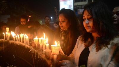 Indian mourners take part in candle light vigil as they pay homage to the killed service members in Siliguri on February 17, 2019, after an attack on a paramilitary Central Reserve Police Force (CRPF) convoy in the Lethpora area of Kashmir. India and Pakistan's troubled ties risked taking a dangerous new turn on February 15 as New Delhi accused Islamabad of harbouring militants behind one of the deadliest attacks in three decades of bloodshed in Indian-administered Kashmir. / AFP / Diptendu DUTTA