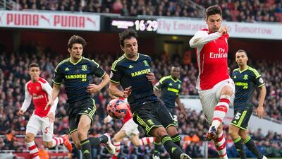 Arsenal forward Olivier Giroud, right, sealed the game in the first half with two strikes inside three minutes. Andrew Cowie / EPA