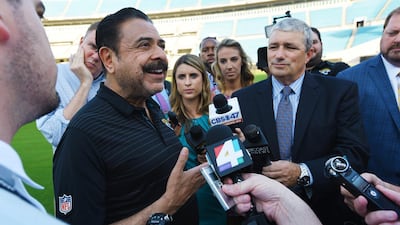 Jacksonville Jaguars owner Shahid Khan, left, fields questions from the media on his interest in buying Wembley Stadium in London. Bob Self/The Florida Times-Union via AP