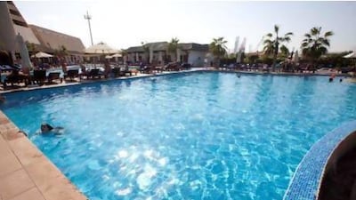 People enjoy the pool of the Radisson Blu Resort in Sharjah. Jaime Puebla/The National Newspaper
