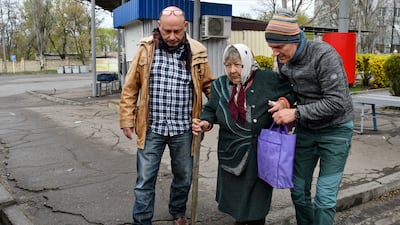 Maria Dyachenko, 83, is helped into a vehicle during the evacuation of civilians in Kramatorsk, Ukraine. AP