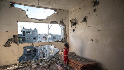 A Palestinian girl stands amid the rubble of her home destroyed by Israeli air strikes on May 24, in Beit Hanoun, Gaza. Getty Images