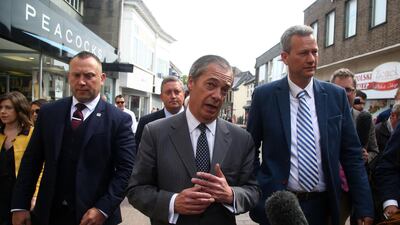 Brexit Party leader Nigel Farage and Brexit Party MEP candidates for Wales, James Wells and Nathan Gill attend a European Parliament election campaign rally. AFP