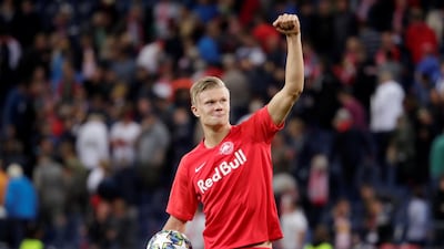 Erling Braut Haaland celebrates his hat-trick with the match ball. Reuters