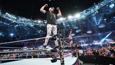 Tyson Fury and Drew McIntyre pose on the ropes for fans.