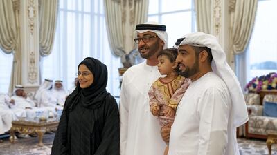 Sheikh Mohamed bin Zayed meets family members who received the Amnetak Beladak souvenir, during a Sea Palace barza. Mohamed Al Hammadi / Ministry of Presidential Affairs