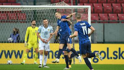 Slovakia's Jan Gregus, centre, celebrates scoring his side's first goal during the Uefa Nations League match against Scotland at City Arena, Trnava, on Sunday. PA